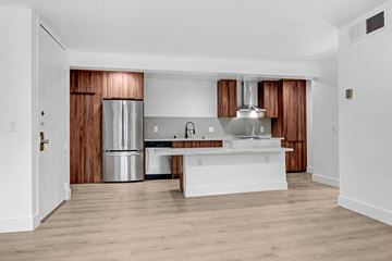 West Hollywood apartment for rent - A modern kitchen with wooden cabinets and stainless steel appliances.