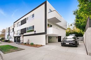 Los Angeles apartment for rent - a white and black house with a car parked in front of it