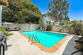 West Hollywood apartment for rent - A small pool with a concrete floor and a wall surrounding it.