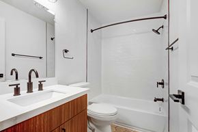 Los Angeles apartment for rent - A white bathroom with a toilet, sink, and shower.