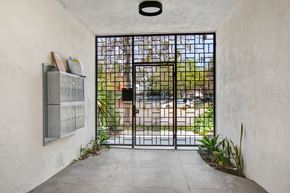 Venice apartment for rent - A black gate is closed and locked.
