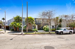 Venice apartment for rent - A street view of a residential area with a white car parked on the side of the road.