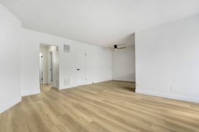 Venice apartment for rent - A room with wooden floors and white walls.
