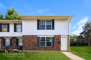 Huber Heights townhouse for rent - A house with a white and brick exterior is for sale.