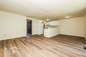 Huber Heights townhouse for rent - A room with wood flooring and a kitchenette in the corner.