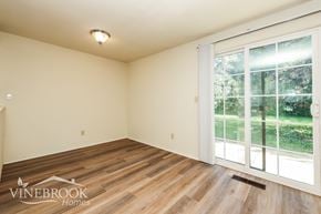 Huber Heights townhouse for rent - A room with a Vinebrook Homes logo on the floor.