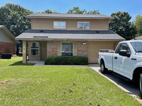 Pensacola house for rent - a house with a truck parked in front of it