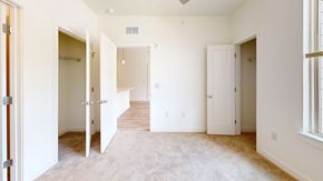 Winchester apartment for rent - a bedroom with three doors and a carpeted floor
