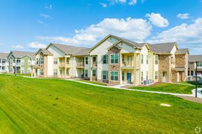 Harrisonburg apartment for rent - an apartment building with a green lawn in front of it