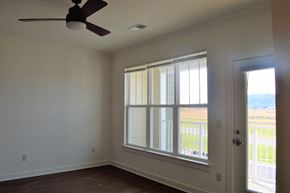 Waynesboro apartment for rent - Bedroom with window, balcony access, and ceiling fan