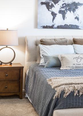 Charles Town apartment for rent - a bedroom with a bed and a nightstand with a lamp