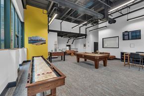 Providence apartment for rent - A room with a pool table and a yellow wall.
