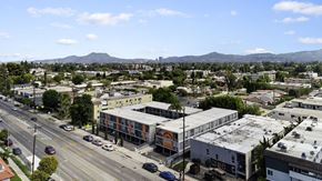Valley Village apartment for rent - A city street with cars and buildings.