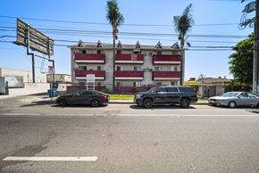 N. Hollywood apartment for rent - A black car is parked on the left side of the street.