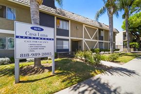 Van Nuys apartment for rent - A sign for Casa Luna Apartments is displayed in front of a building.