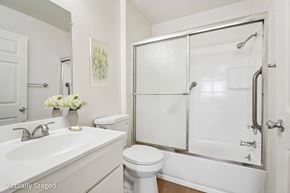 Los Angeles apartment for rent - A white bathroom with a toilet, sink, and shower.