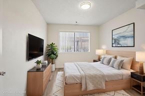 North Hills apartment for rent - A large bedroom with a window letting in natural light