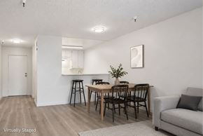 North Hills apartment for rent - A dining room with a table and chairs.