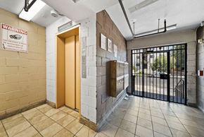 Los Angeles apartment for rent - A warning sign is on the wall in front of a door.