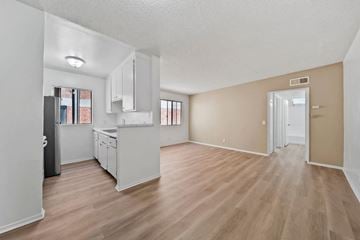 Los Angeles apartment for rent - A kitchen with white cabinets and a refrigerator.