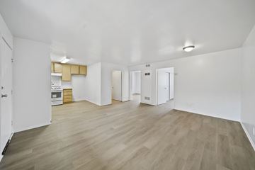 Los Angeles apartment for rent - A spacious room with wooden flooring and white walls.