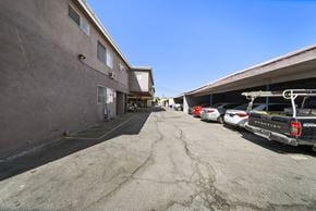 North Hills apartment for rent - A parking lot with several cars and a building on the left.