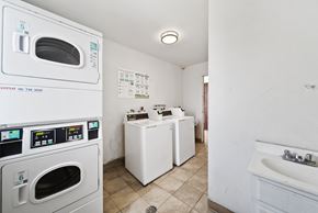 Los Angeles apartment for rent - A small laundry room with a washer and dryer.