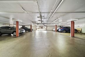 Los Angeles apartment for rent - A parking garage with several cars parked in it.
