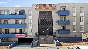 Los Angeles apartment for rent - A building with a black gate and a sign that says "NO RENTING" in front of it.
