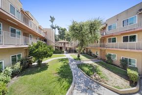 Pasadena apartment for rent - A courtyard surrounded by apartment buildings on a sunny day.