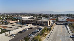 Pico Rivera apartment for rent - A parking lot with a mountain in the background.