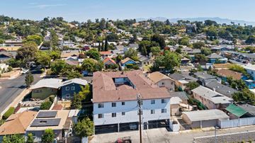 Los Angeles apartment for rent - A bird's eye view of a residential area with houses and trees.