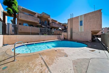 North Hills apartment for rent - A pool in a courtyard surrounded by buildings.