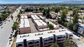 North Hills apartment for rent - A large apartment complex sits in the middle of a city street.