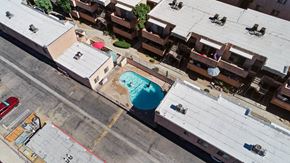 North Hills apartment for rent - A red car is parked on the side of a road.