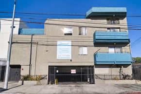 North Hills apartment for rent - A building with a sign that says "Sunset" on it.