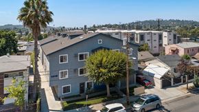 Los Angeles apartment for rent - A residential area with houses and parked cars.