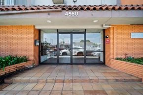 Hawthorne apartment for rent - The entrance to a building with a glass door and a sign that reads "4560".