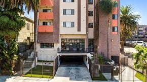 Los Angeles apartment for rent - A building with a garage door open in front of it.