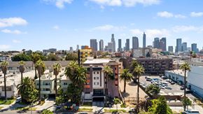 Los Angeles apartment for rent - A cityscape with a clear blue sky and buildings in the distance.