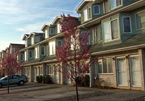 Staten Island apartment for rent - A row of houses with trees in front of them. at Seaview Apartments in Staten Island, NY, 10305