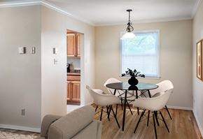 Piscataway apartment for rent - A dining room with a glass table and white chairs at Rivercrest Apartments, Piscataway