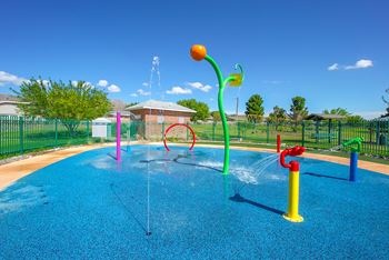 A water park with colorful water toys in a blue pool