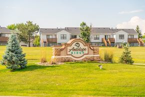 Box Elder apartment for rent - A sign for Antelope Ridge in front of houses.