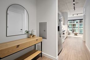 Chicago apartment for rent - A modern kitchen with a wooden counter and stainless steel appliances.