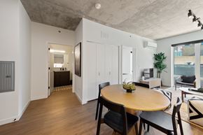 Chicago apartment for rent - A dining room with a wooden table and chairs.