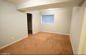 Chicago apartment for rent - a empty room with a blue and white wall and a carpet