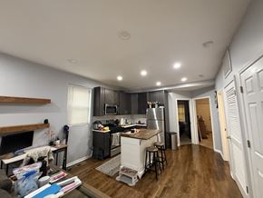 Chicago apartment for rent - A kitchen with a refrigerator, stove, and sink.