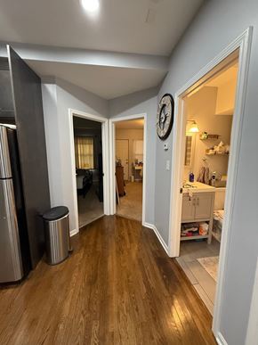 Chicago apartment for rent - A kitchen with a refrigerator and a trash can.