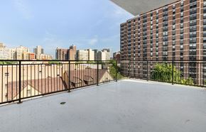 Chicago apartment for rent - the balcony has a view of the city and the pool